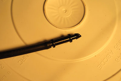 A double-ended, barbed connector and a length of 1/4-inch plastic tubing