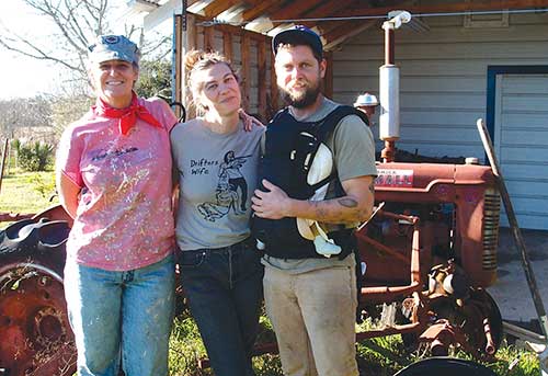 Left to right: Katie Pitre, Finnegan Ferreboeuf and Jason Gold (with Izzy) at Tecolote Farm.