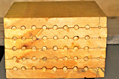 Fig. 11. Stacked pages closed with dowel pieces on one end.