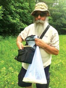 Eric Frohmberg with his bee collecting kit. Photo courtesy of the Frohmbergs