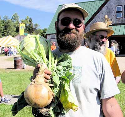 Organic farmer Jason Kafka grew this onion and kohlrabi from seed. Jean English photo Organic farmer Jason Kafka grew this onion and kohlrabi from seed. Jean English photo