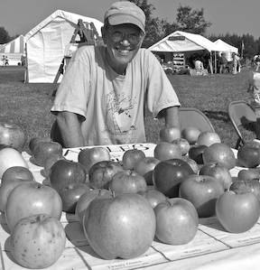 John Bunker offering apple identification at the Common Ground Country Fair. English photo