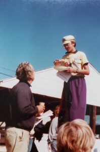 Boy on stilts eating pizza