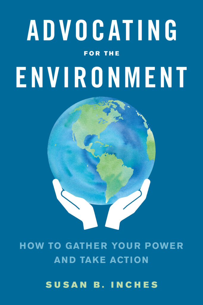 Blue book cover with two white hands holding an earth with the title "Advocating for the Environment"
