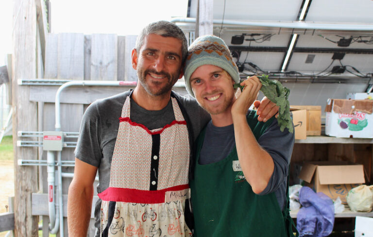 Two volunteers smiling at Common Kitchen