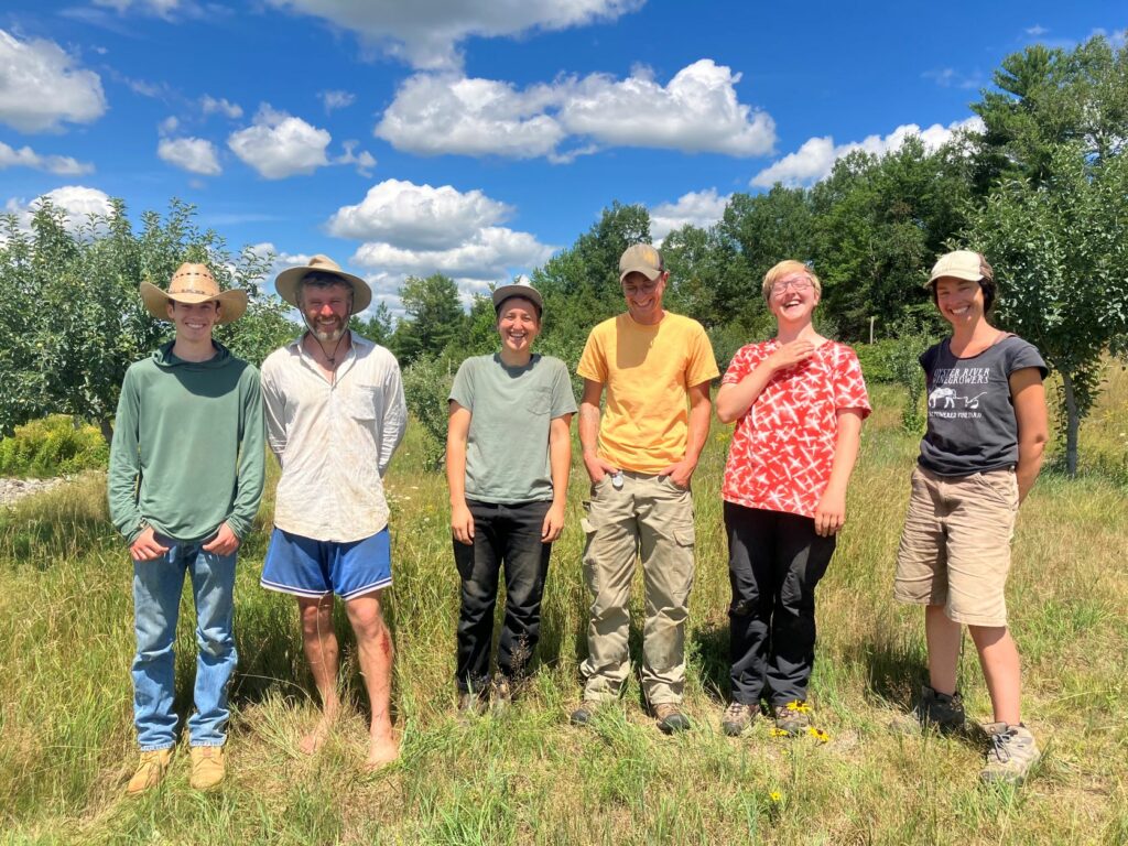 Smiling staff group photo at the Maine Heritage Orchard.