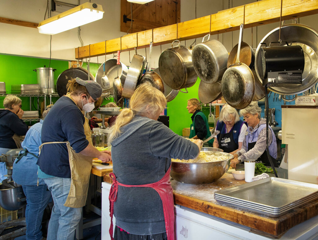 A group of volunteers at work in the Common Kitchen.