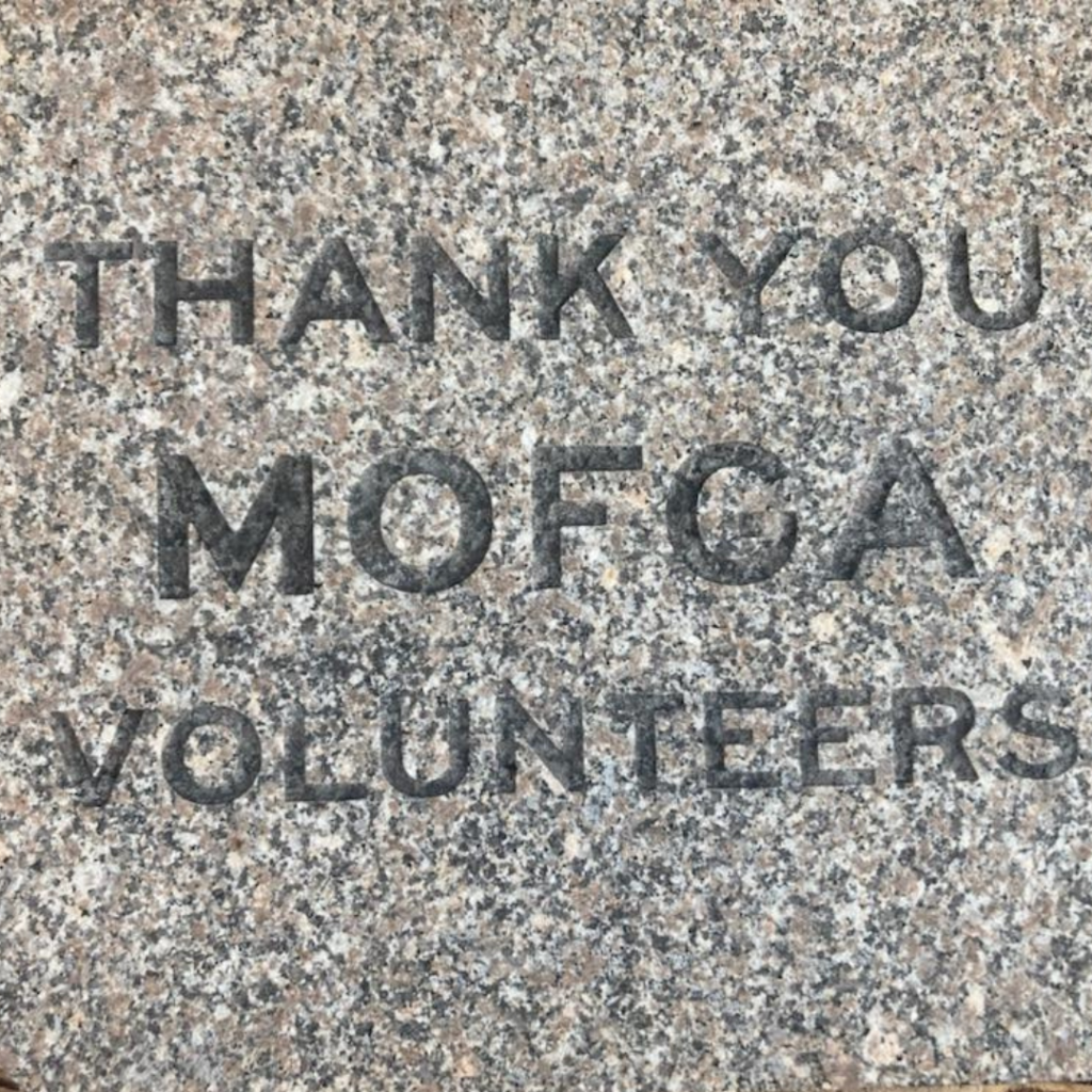 a stone engraved with the words "THANK YOU MOFGA VOLUNTEERS"