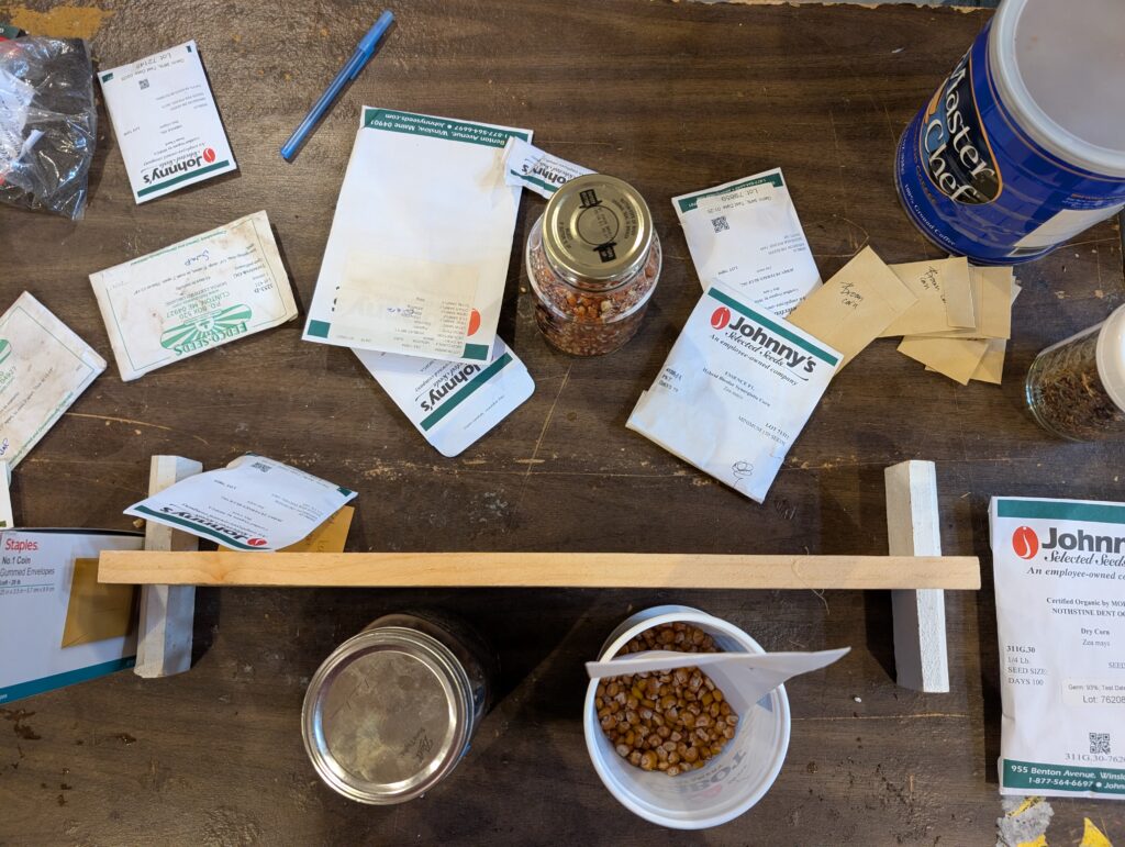 Seeds in packets and other containers are featured on the seed swap table