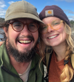 head shot of two smiling farmers
